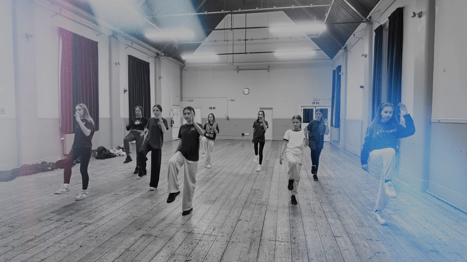 Group of dancers practicing in a studio