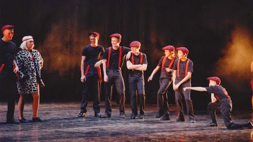 Group of dancers performing on stage