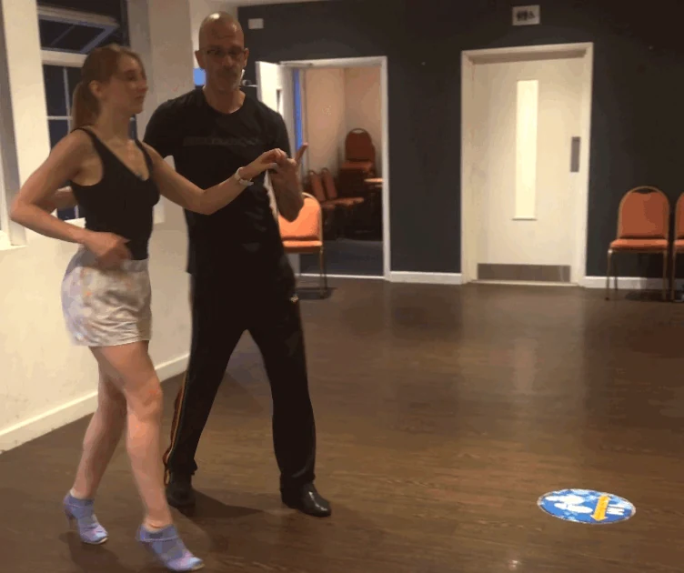 Couple dancing in a studio setting