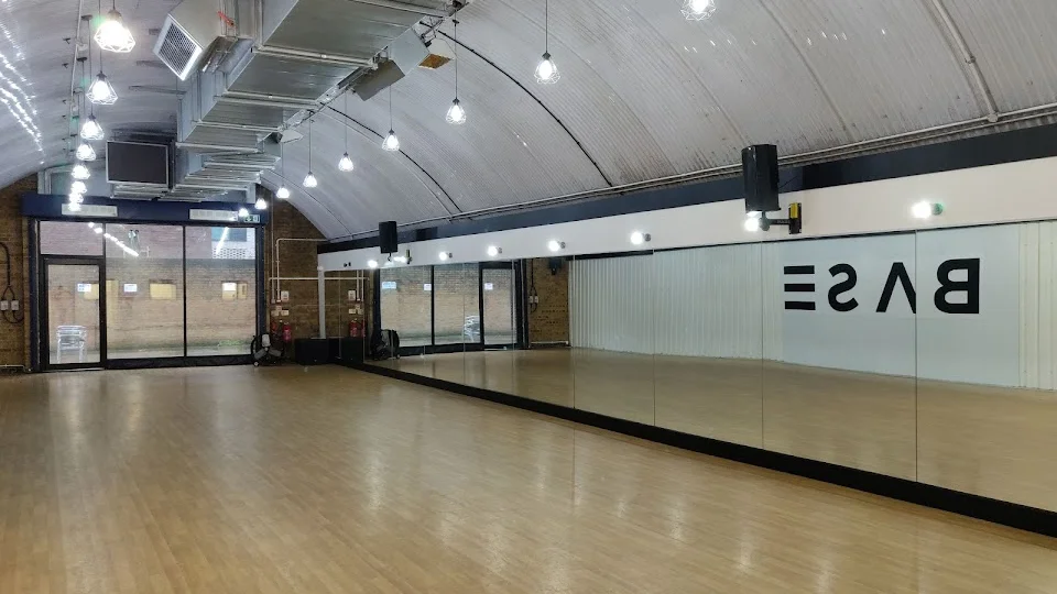 Dance studio interior with mirrors and wooden floor