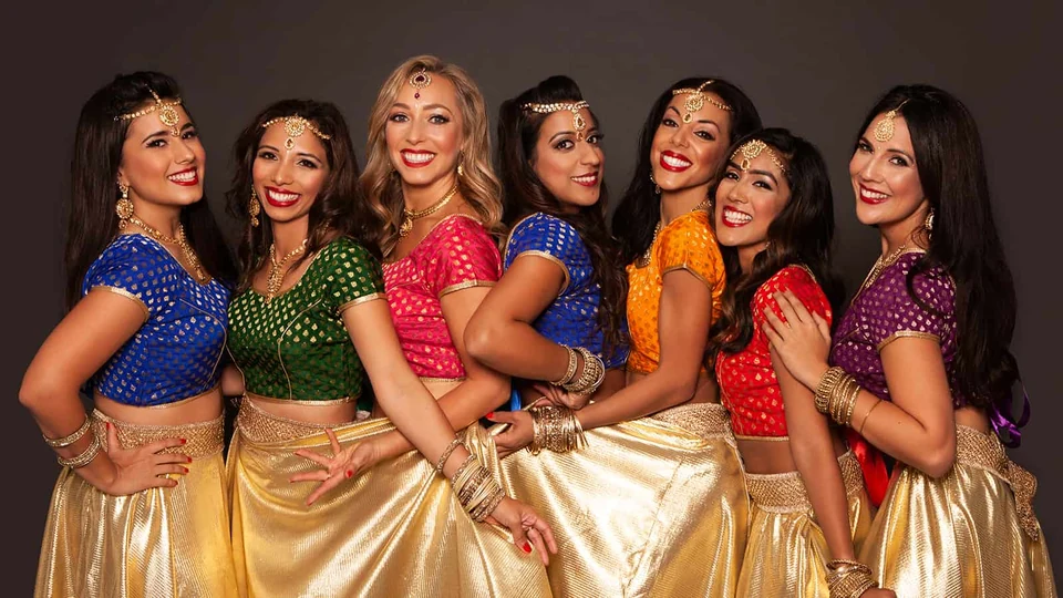 Group of women in colorful traditional dance attire