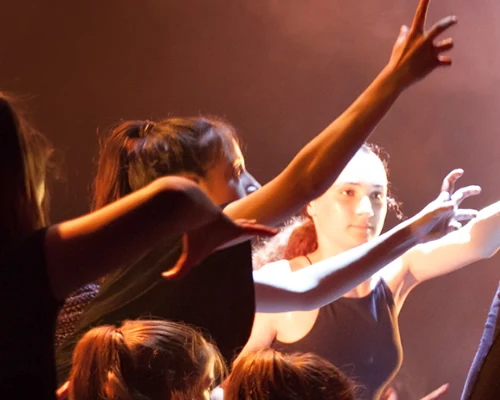 Dancers performing with expressive hand movements