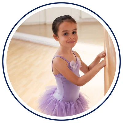 Young girl in ballet attire at a dance studio