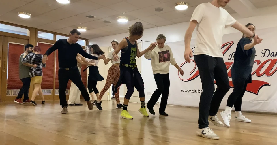 Group of dancers practicing in a dance studio