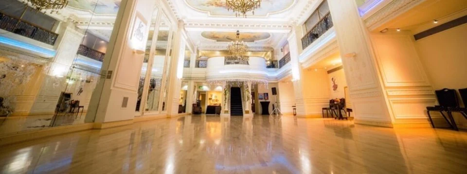 Elegant dance studio with mirrors and chandeliers