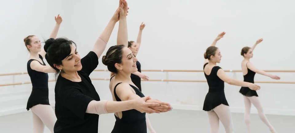 Ballet class with dancers in a studio setting