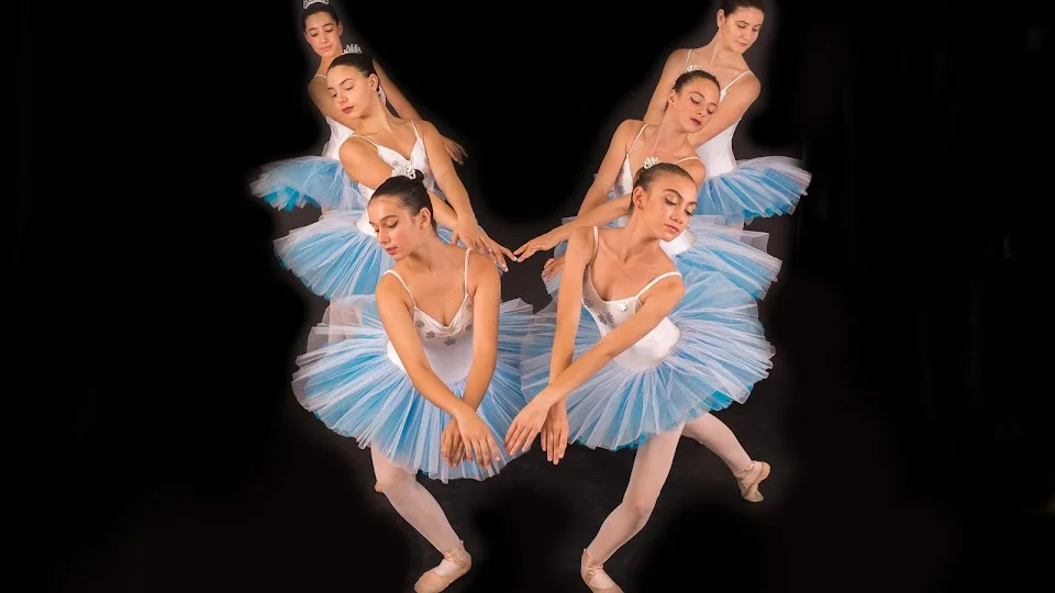 Group of ballet dancers in tutus performing