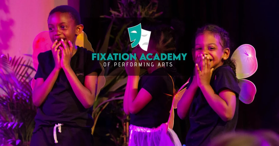 Children performing on stage at a dance school event
