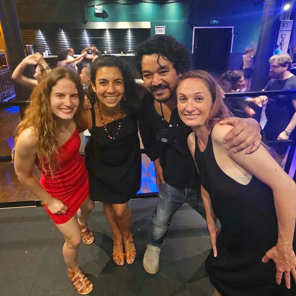 Group of dancers posing together at an event