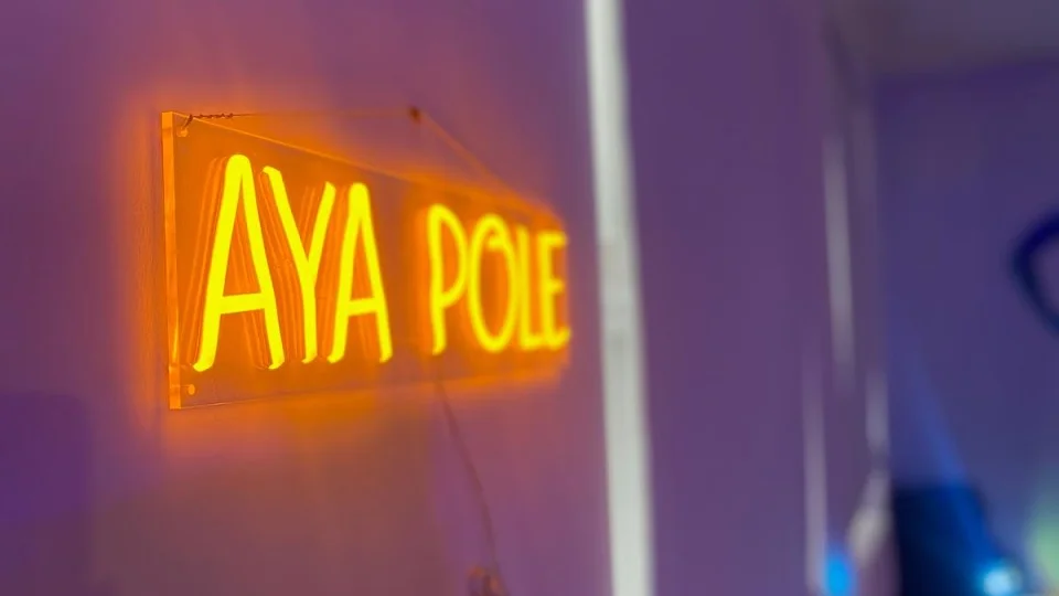 Neon sign displaying 'AYA POLE'