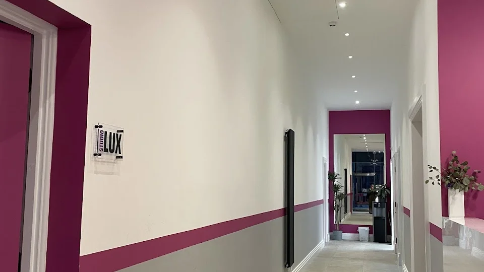 Interior hallway with pink and gray walls