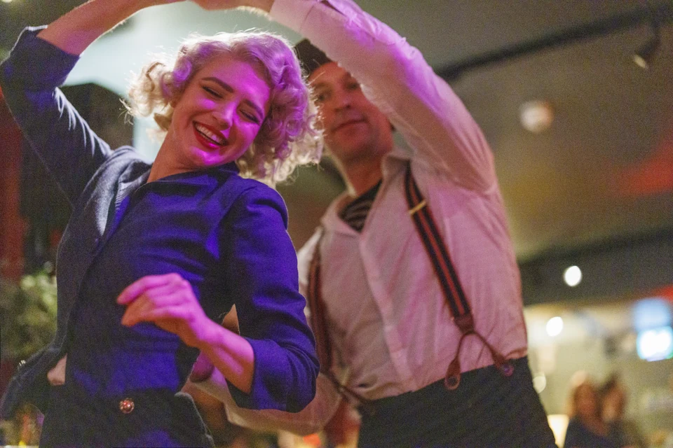 Couple dancing in a lively setting