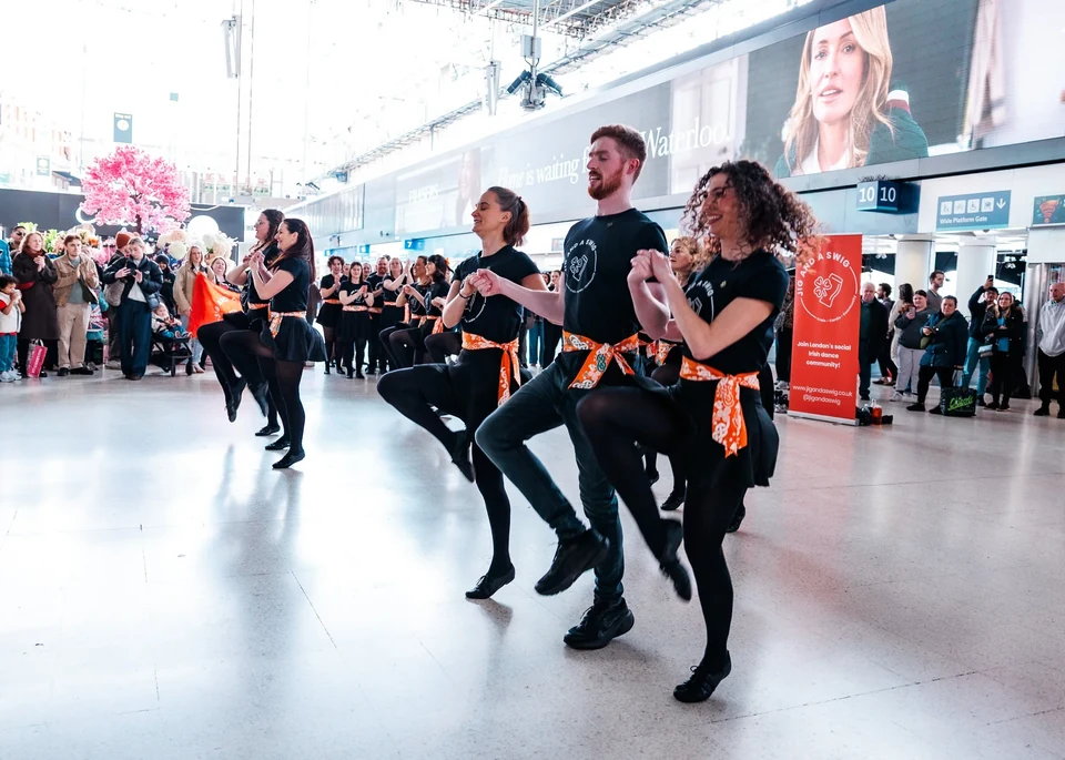 Group performing Irish dance in a public space
