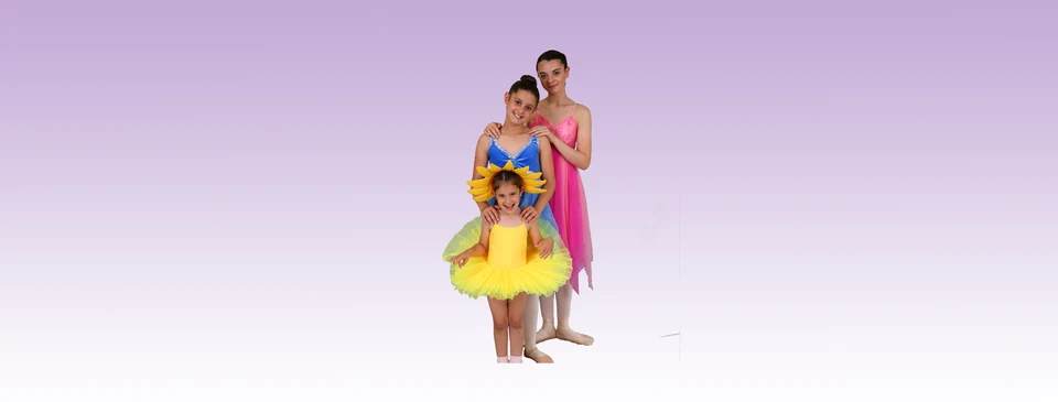 Three dancers in colorful costumes posing together
