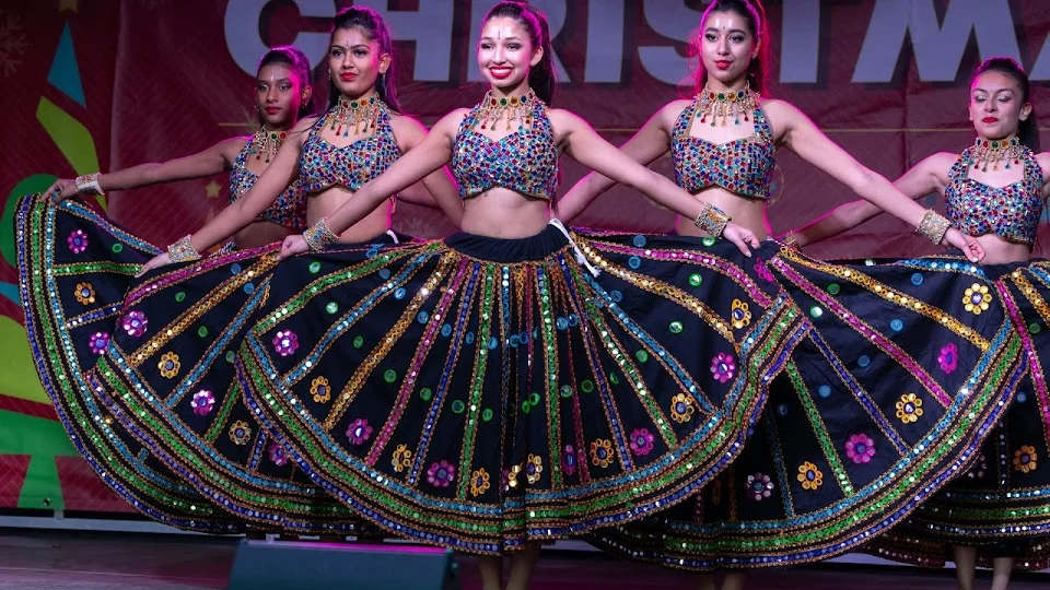 Women performing traditional dance in colorful costumes