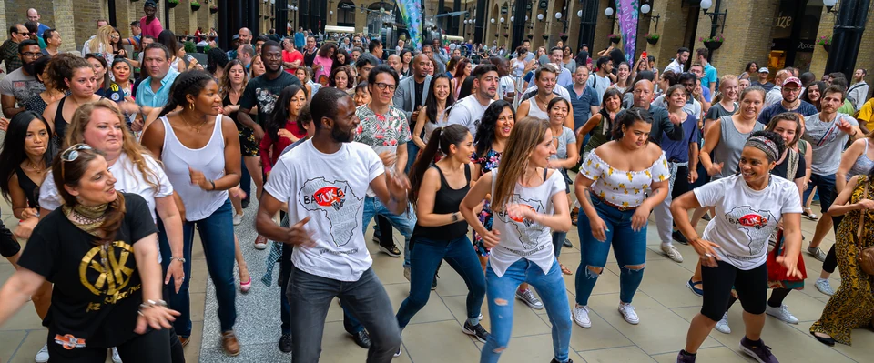 Group of people dancing in a public space