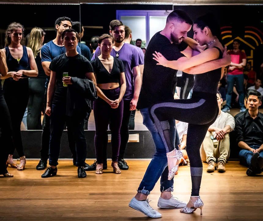 Couple dancing in a studio with audience watching