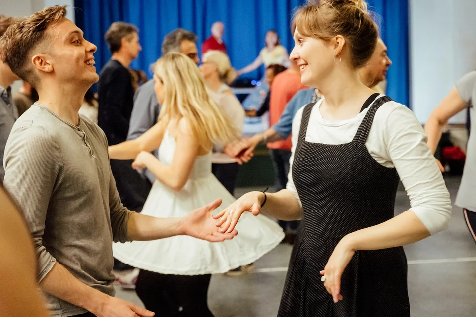 Couple dancing in a lively dance class