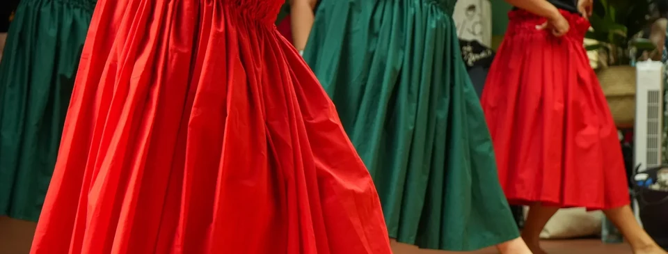Dancers in colorful skirts performing hula dance