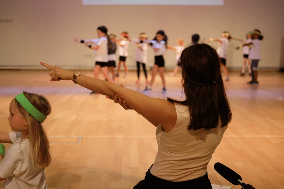 Dance class with children performing on stage