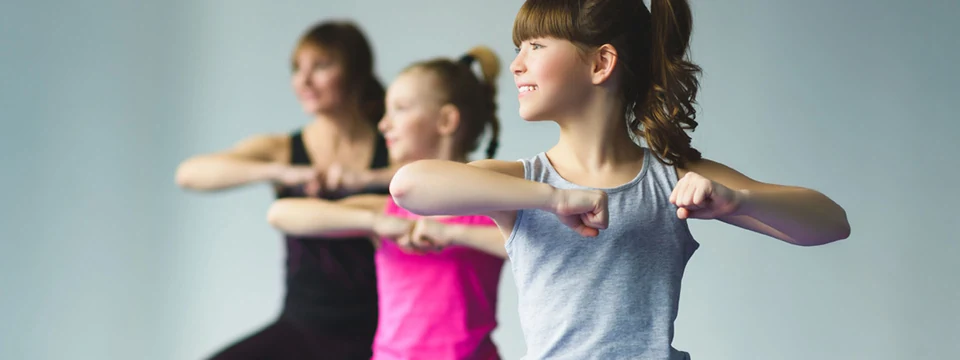 Three girls dancing in a studio setting