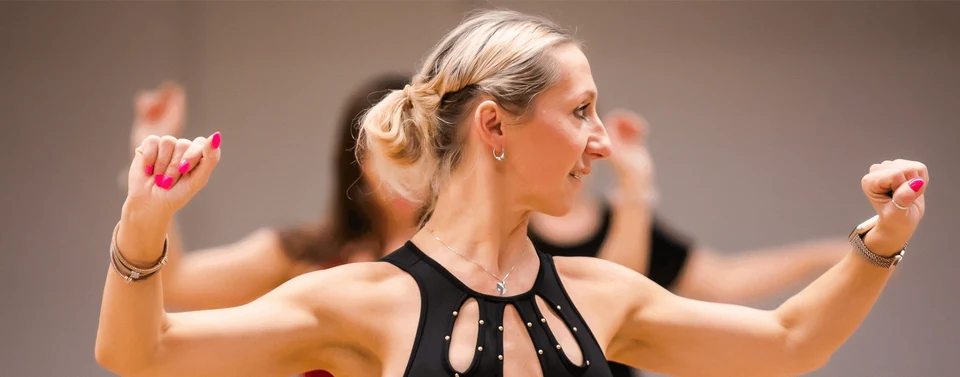 Woman dancing in a dance class setting