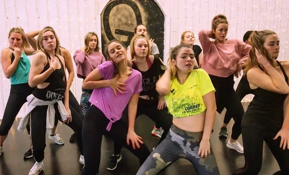 Group of dancers performing in a studio