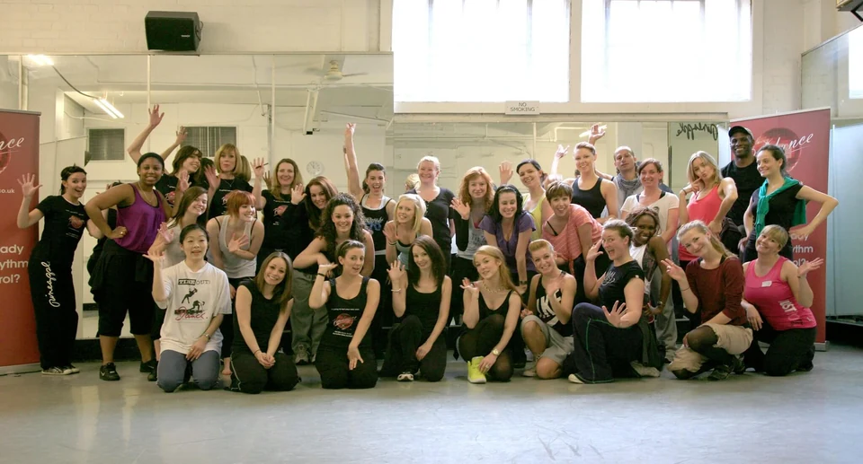 Group of dancers posing in a studio