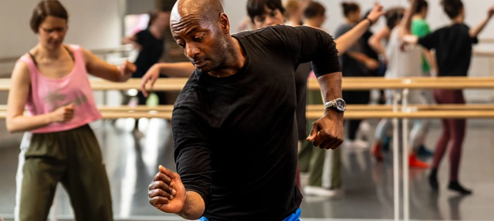 Dance class in progress with diverse participants