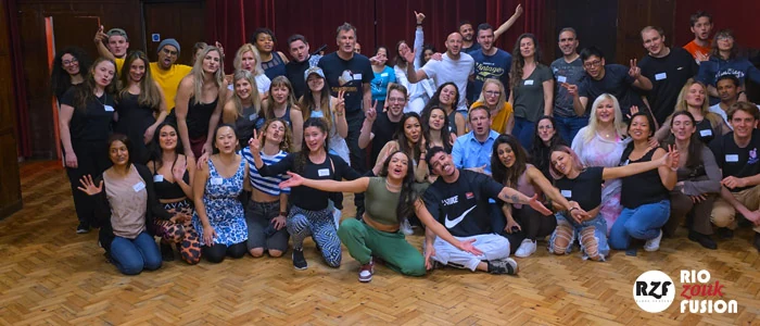 Group of dancers posing in a studio setting