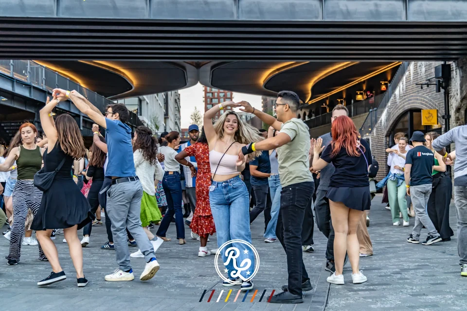 Group of people dancing outdoors in Camden