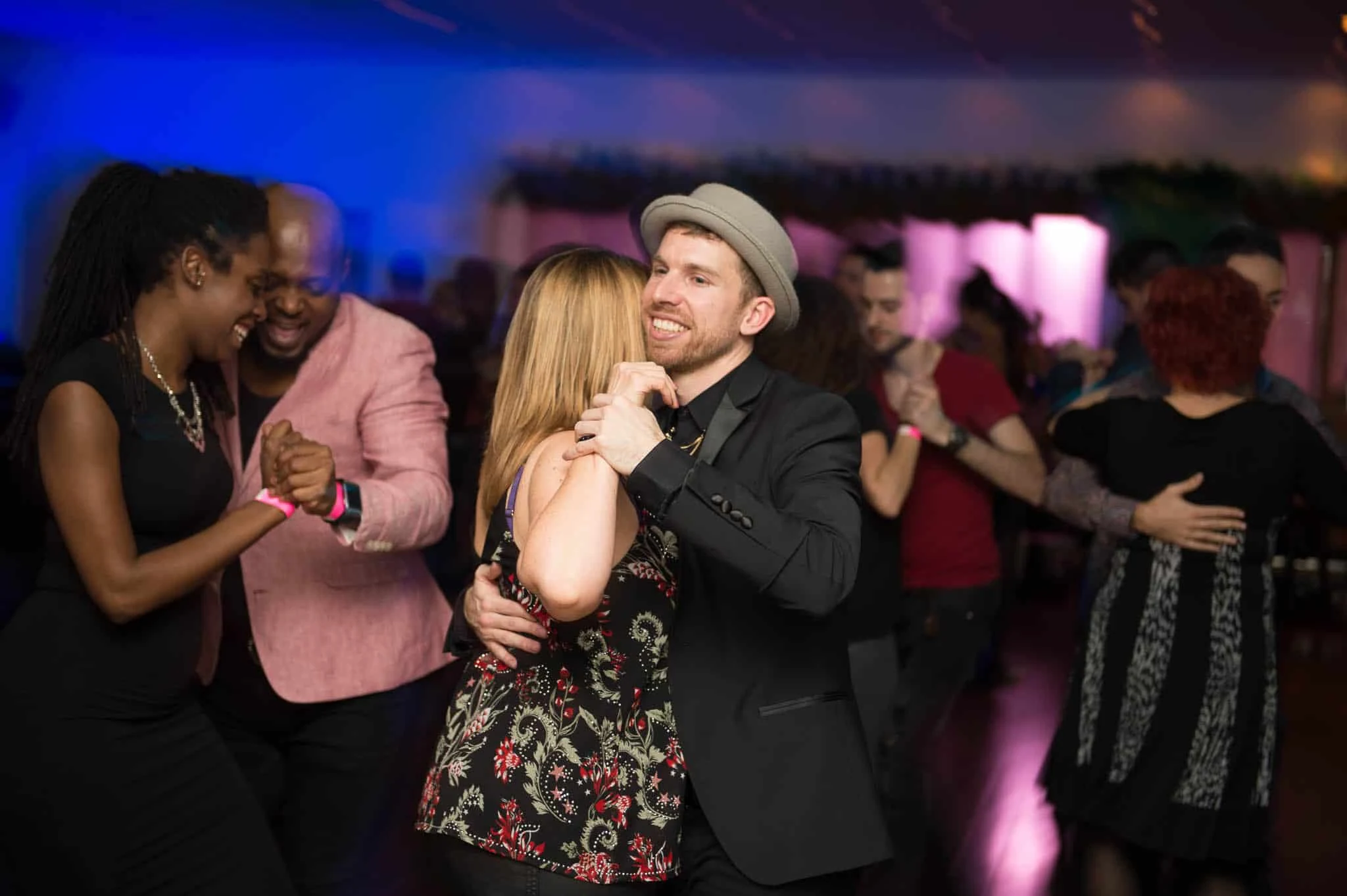 People dancing at a salsa event in a venue