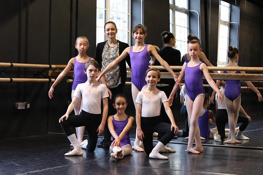 Group of young ballet dancers in a studio