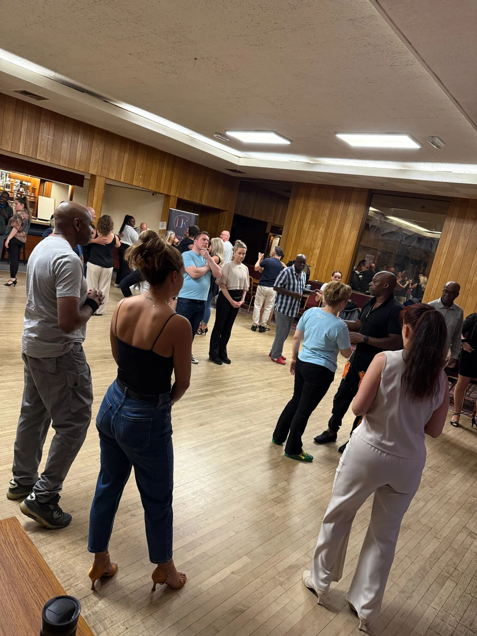 Group of people dancing in a studio setting