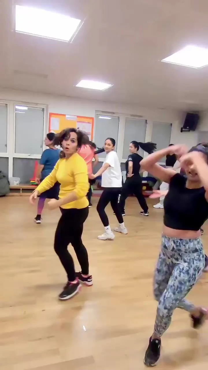 Adults dancing in a studio during a Bollywood class
