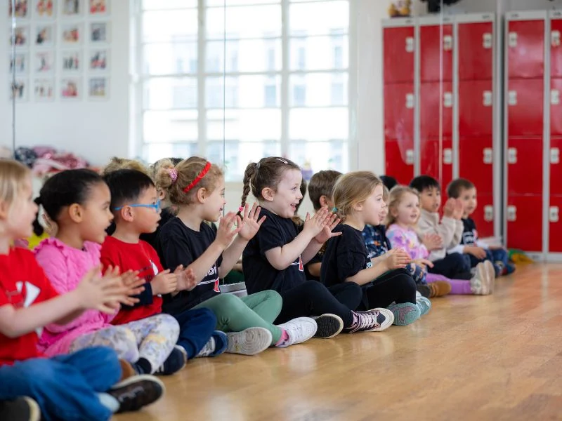 Children clapping in a dance studio