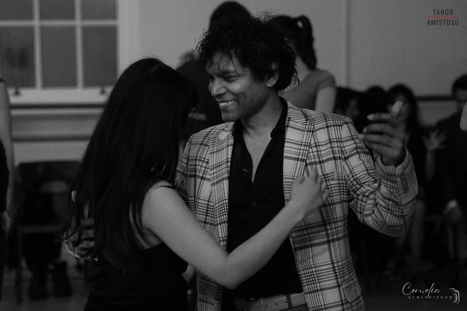 Couple dancing Argentine Tango in a dance studio