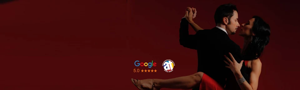 Couple dancing Argentine Tango against a red background