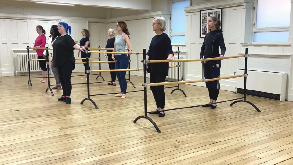 Adult ballet class in a dance studio