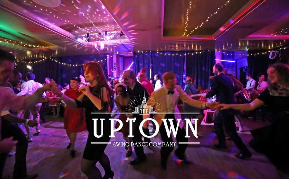 Group of people dancing at a swing dance event