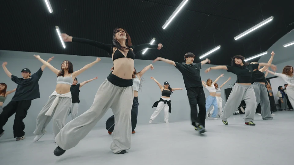Group of dancers performing in a studio