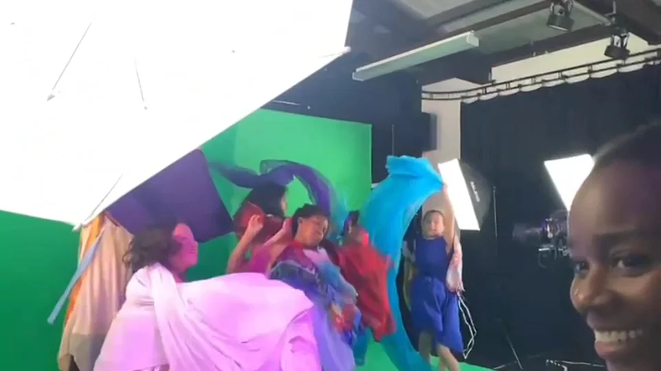 Group of dancers in colorful costumes on stage