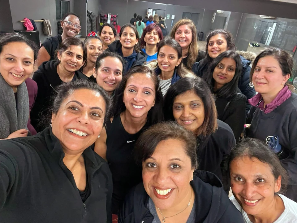 Group of women posing in a dance studio